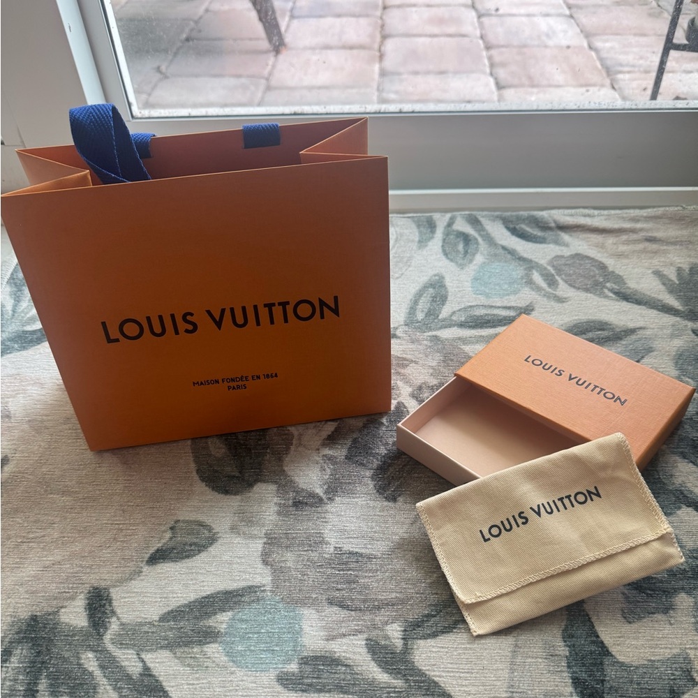 Authentic Louis Vuitton gift bag, box and dust bag.